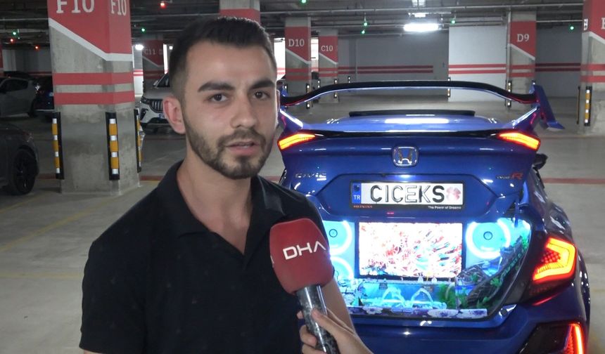 Aracının bagajında televizyon koyup şelale oluşturdu akvaryumda balık besliyor